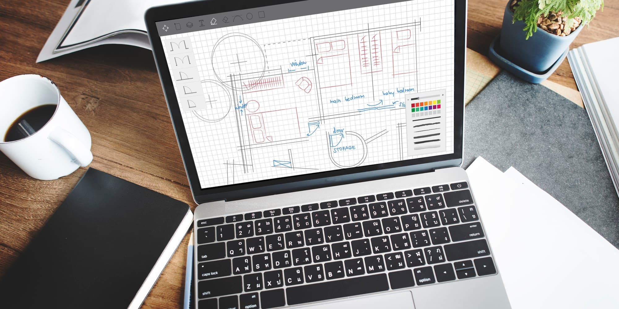 A laptop showing a half-built website alongside a developer's notebook with hand-drawn integration arrows, the operator-side work that gen-AI design tools still leave on the table